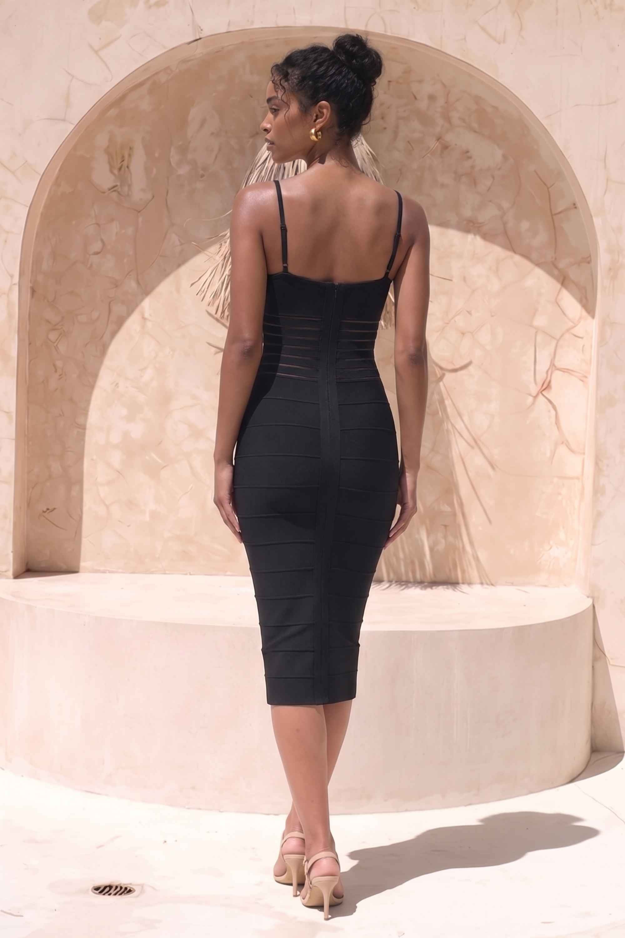Woman wearing a figure flattering Abigail Bodycon Midi Dress - Classic Black BODYCON COLLECTION Pty Ltd
