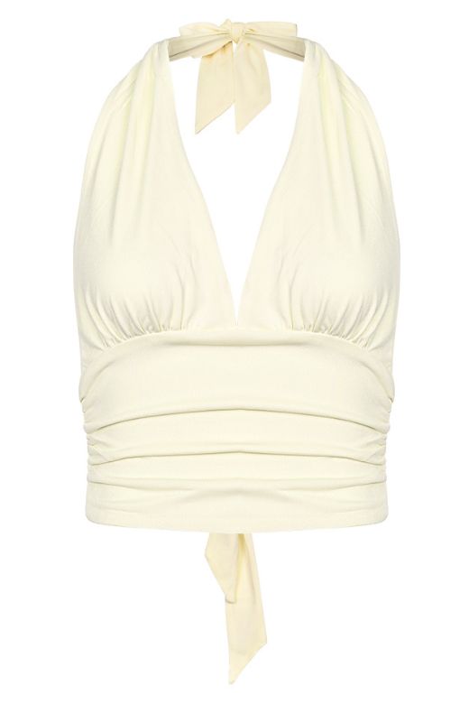 Woman wearing a figure flattering Aby Halter Top - Butter Yellow BODYCON COLLECTION Pty Ltd