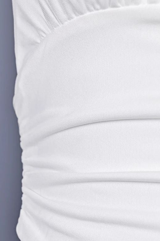 Woman wearing a figure flattering Aby Halter Top - White Pearl BODYCON COLLECTION Pty Ltd