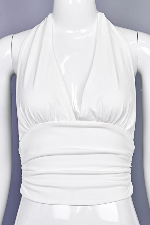 Woman wearing a figure flattering Aby Halter Top - White Pearl BODYCON COLLECTION Pty Ltd