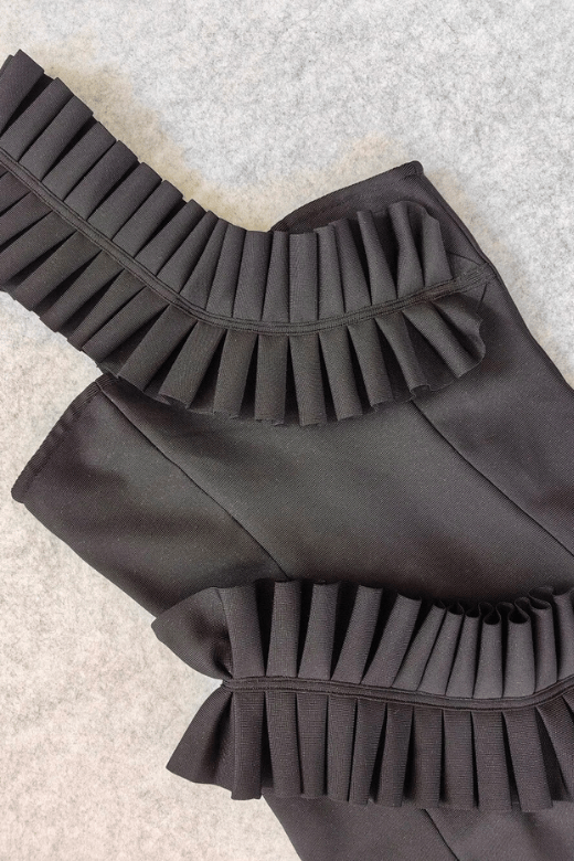 Woman wearing a figure flattering Aimee Bodycon Dress - Classic Black BODYCON COLLECTION