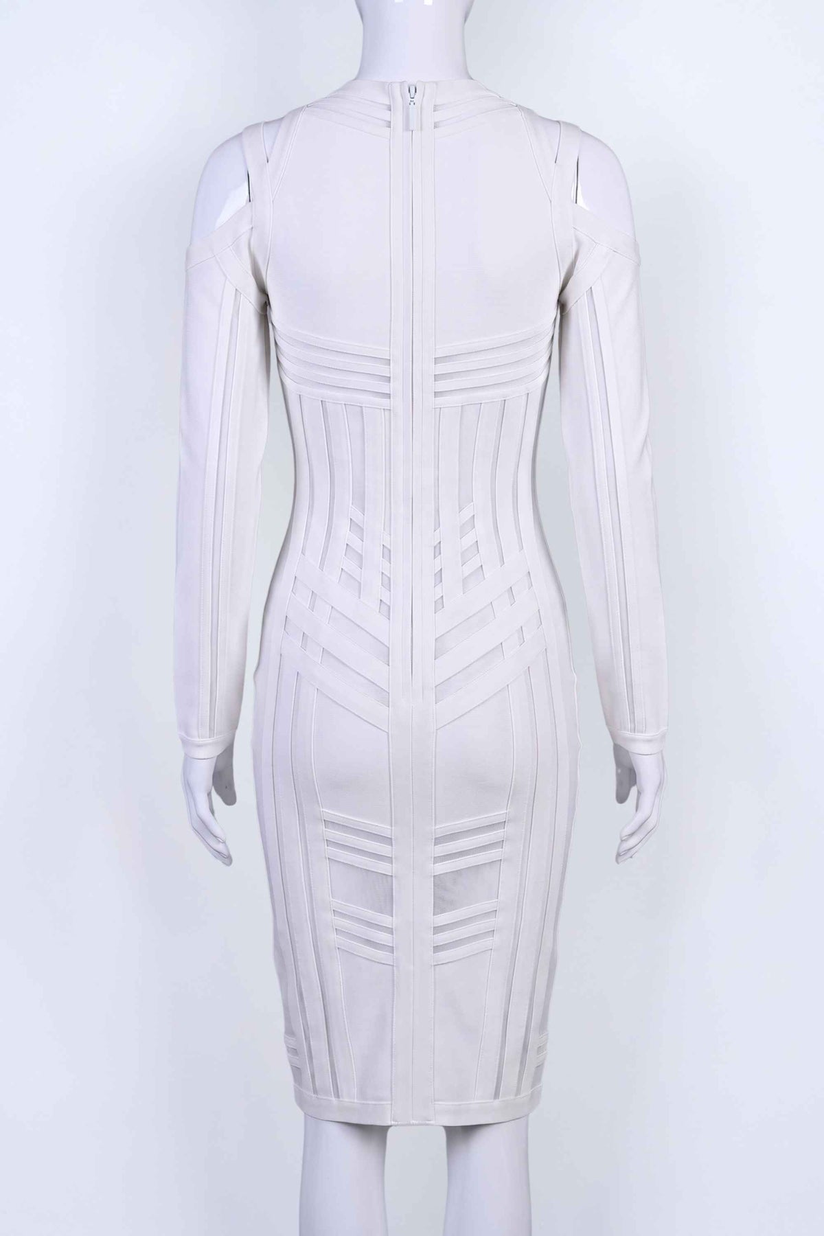 Woman wearing a figure flattering Amelia Long Sleeve Bandage Dress - Pearl White BODYCON COLLECTION