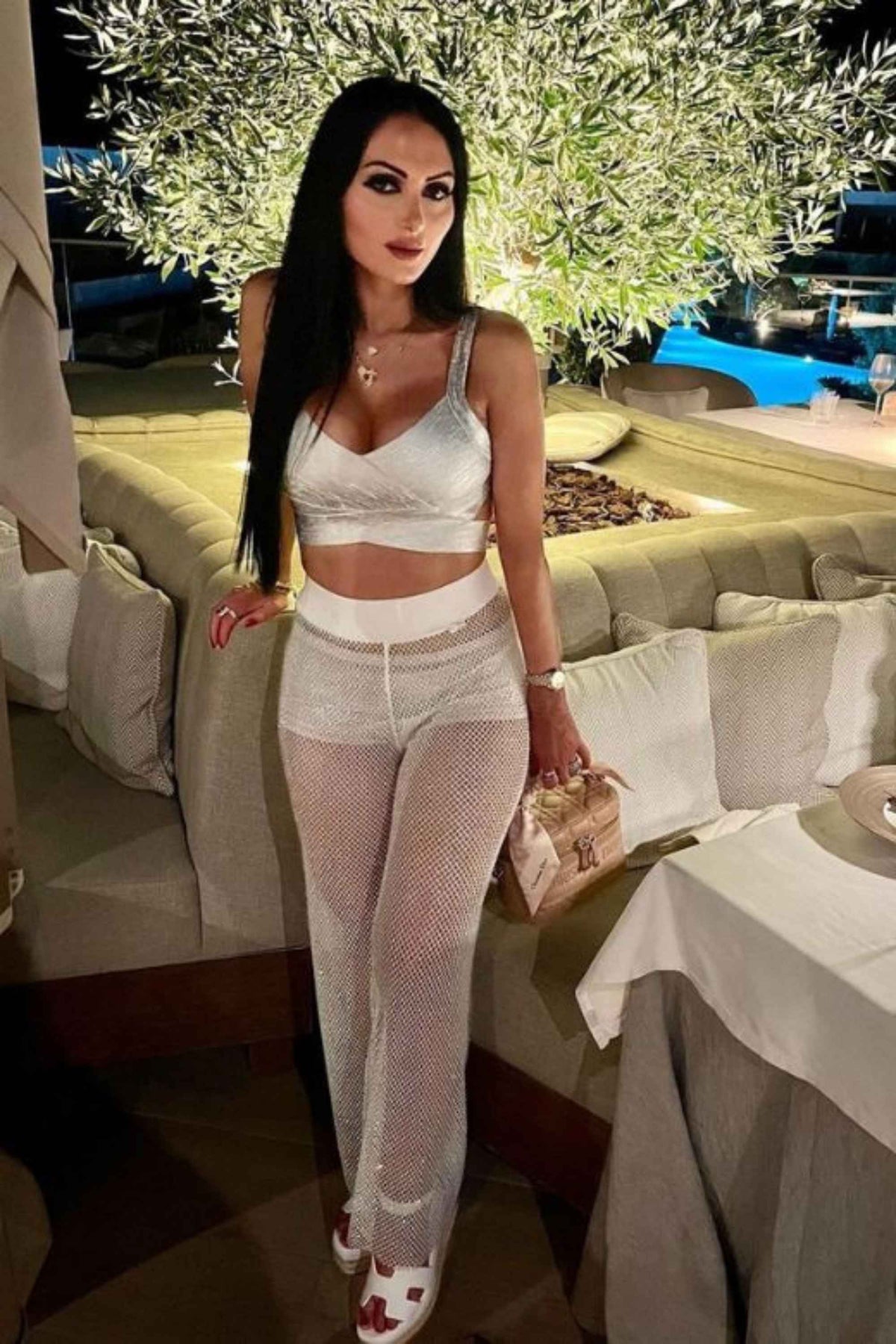 Woman wearing a figure flattering Ang Bandage Leather Crop Top - Gold BODYCON COLLECTION
