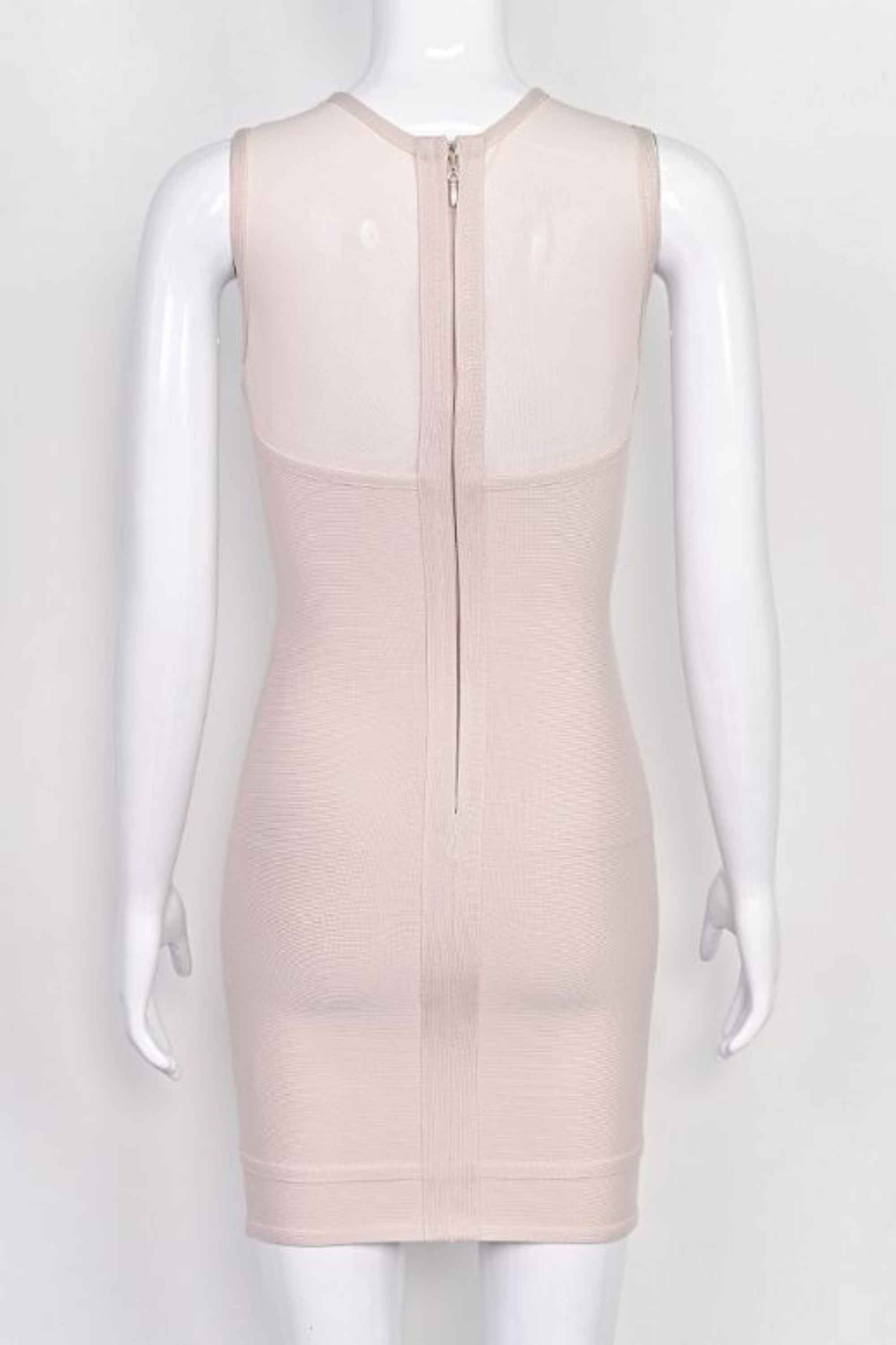 Woman wearing a figure flattering Aspen Bodycon Mini Dress - Nude BODYCON COLLECTION Pty Ltd