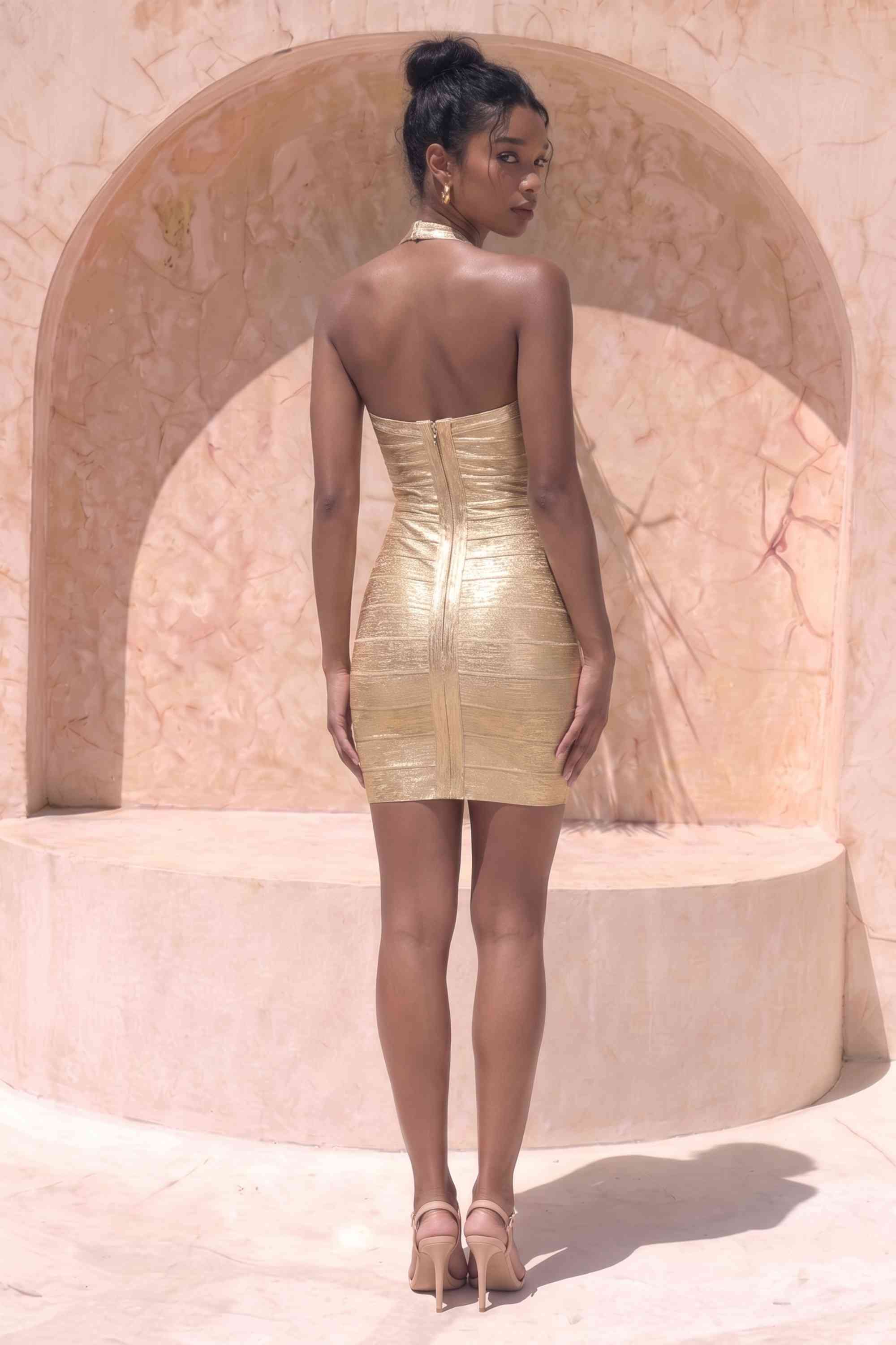 Woman wearing a figure flattering Athena Bandage Mini Dress - Gold BODYCON COLLECTION Pty Ltd