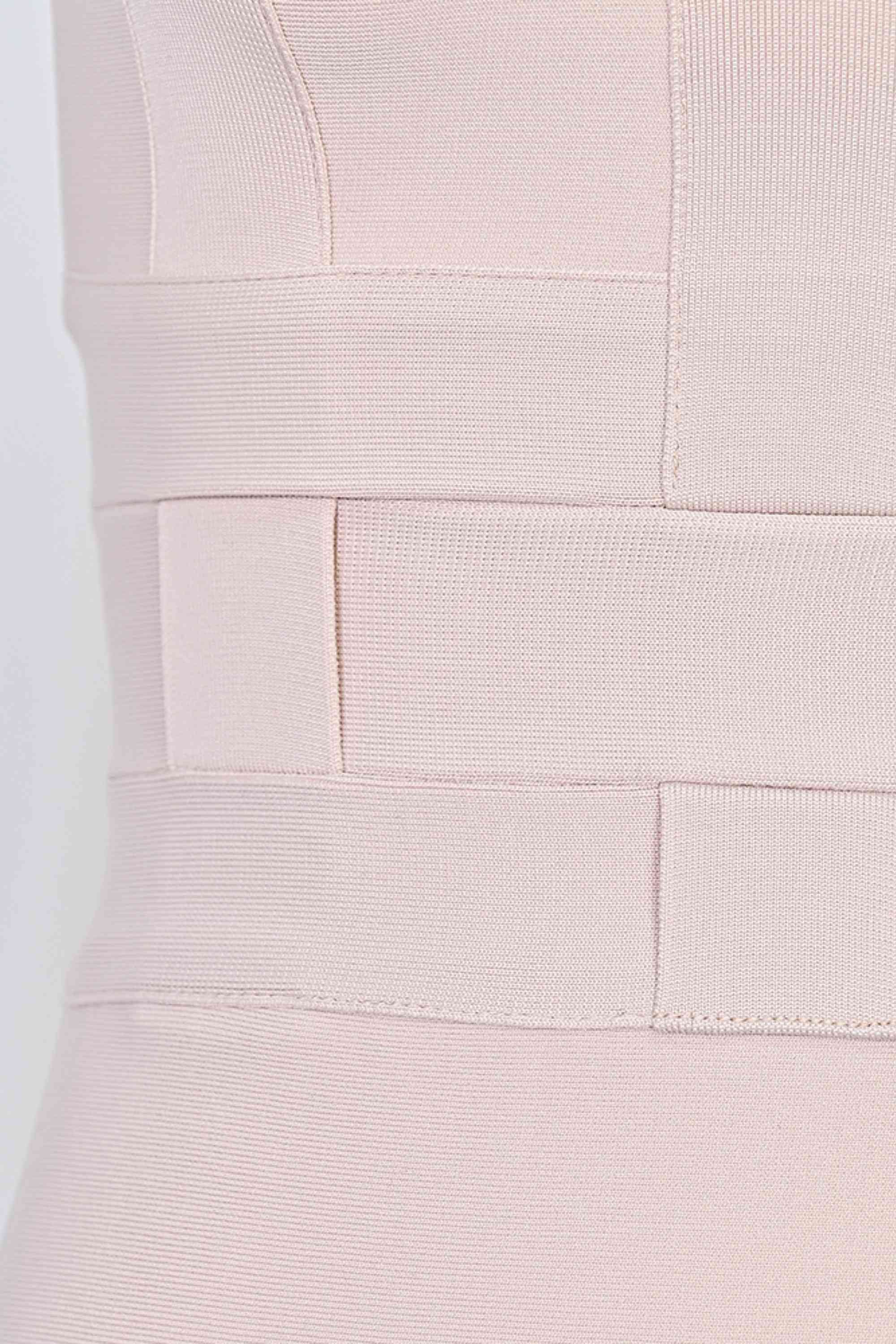 Woman wearing a figure flattering Aurora Bandage Dress - Cream BODYCON COLLECTION Pty Ltd