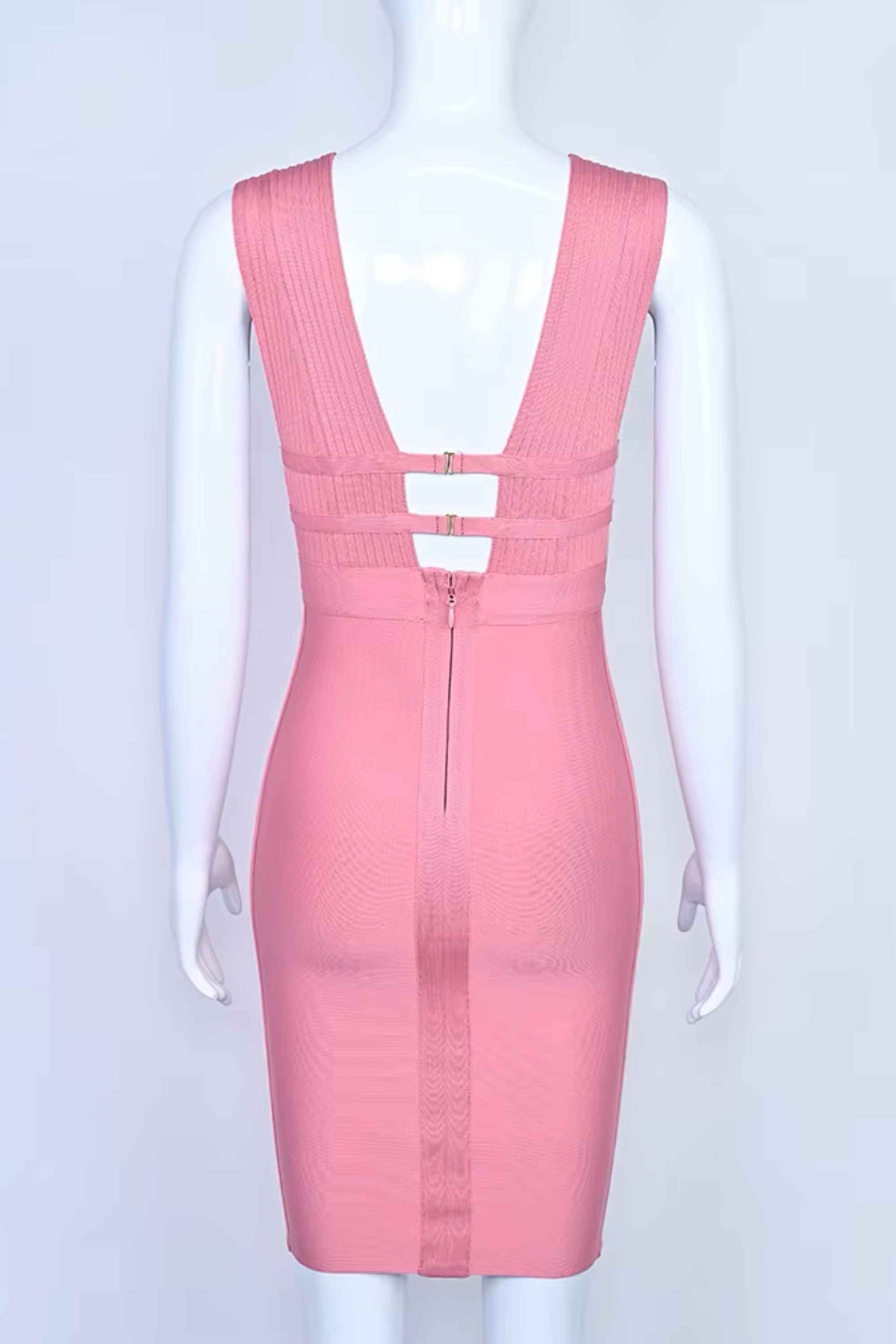 Woman wearing a figure flattering Bay Bandage Dress - Ballet Pink Bodycon Collection
