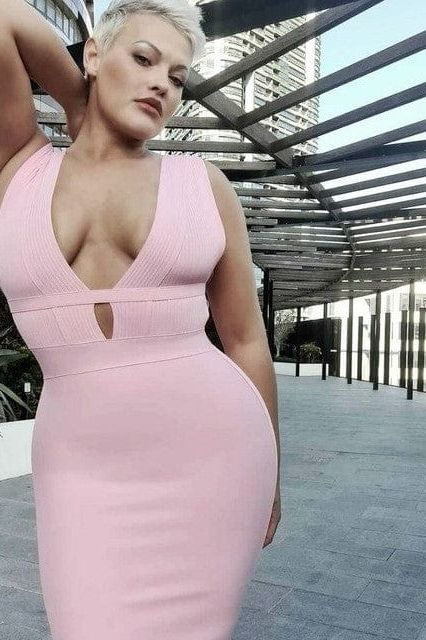 Woman wearing a figure flattering Bay Bandage Dress - Nude Bodycon Collection