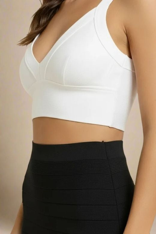 Woman wearing a figure flattering Bee Bandage Crop Top - Pearl White BODYCON COLLECTION