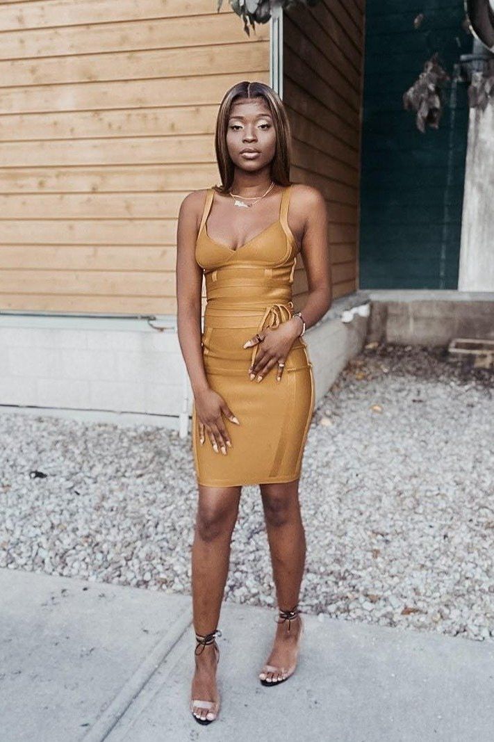 Woman wearing a figure flattering Bek Bandage Dress - Mustard Yellow Bodycon Collection
