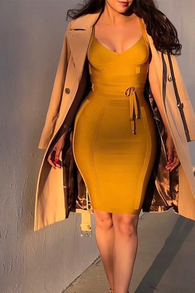 Woman wearing a figure flattering Bek Bandage Dress - Mustard Yellow Bodycon Collection