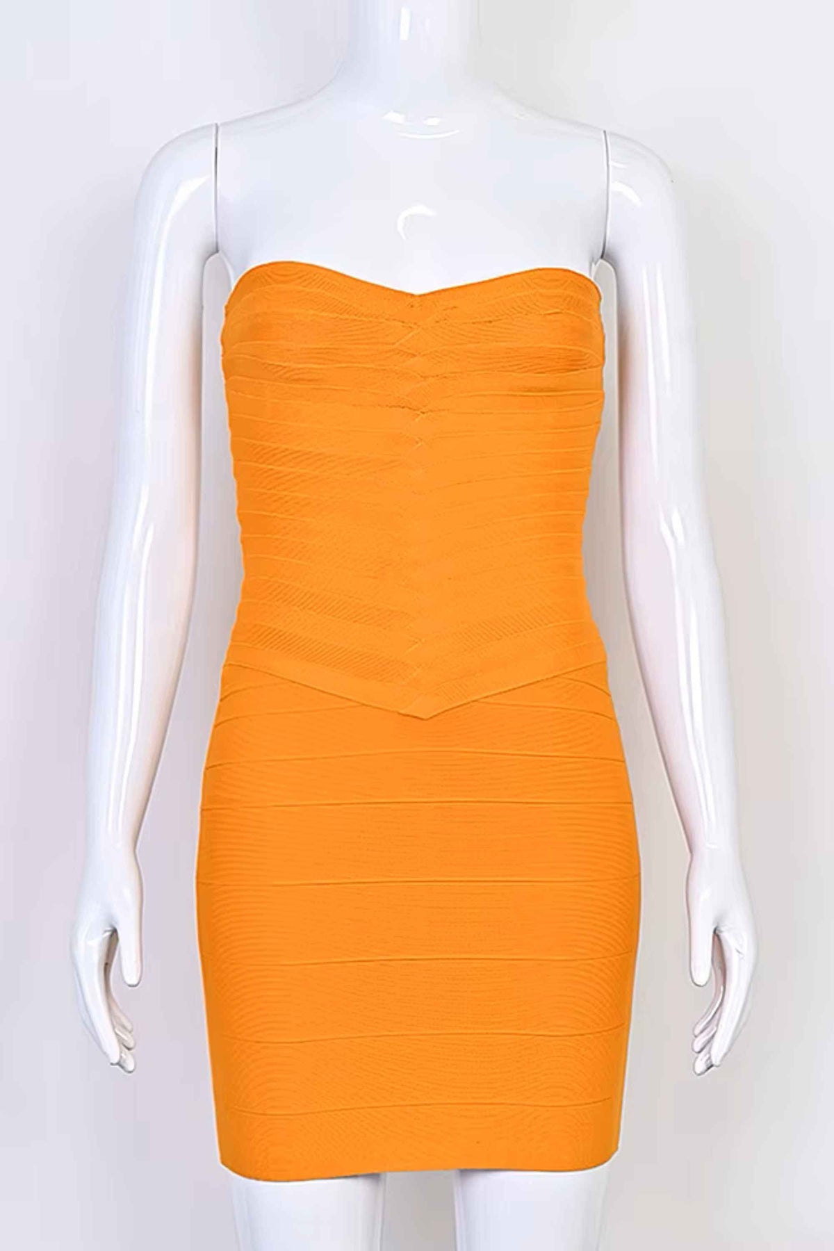 Woman wearing a figure flattering Belle Bandage Mini Dress - Apricot Orange BODYCON COLLECTION Pty Ltd