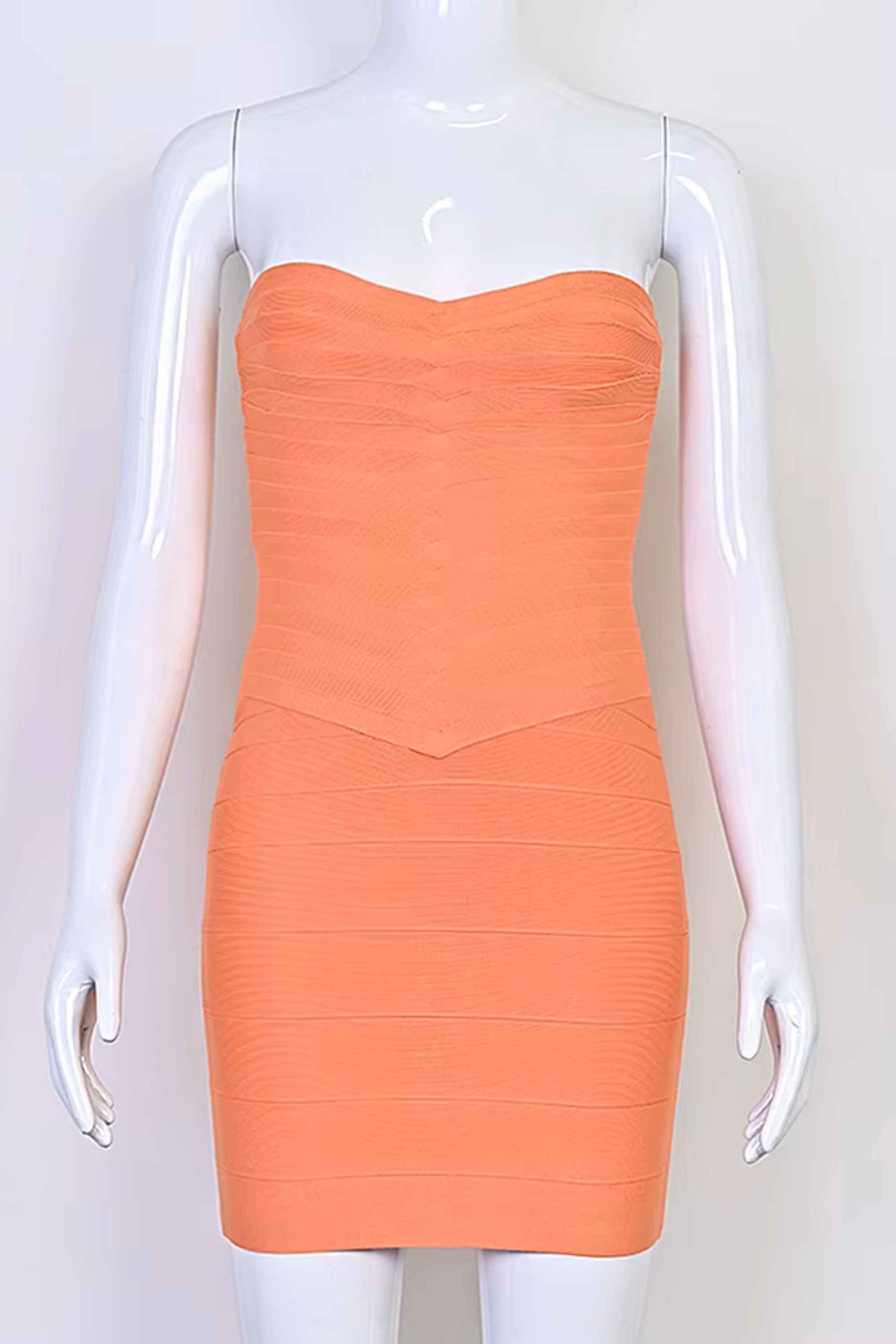 Woman wearing a figure flattering Belle Bandage Mini Dress - Coral BODYCON COLLECTION Pty Ltd