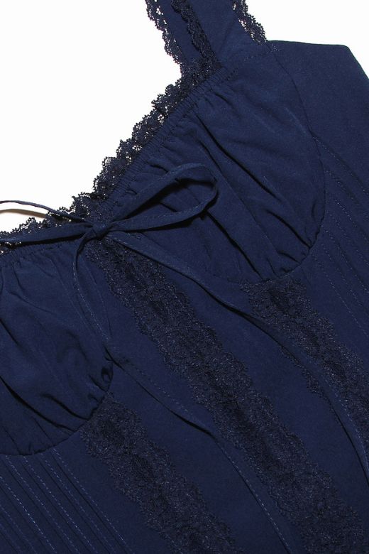 Woman wearing a figure flattering Belle Bodycon Mini Dress - Navy Blue BODYCON COLLECTION