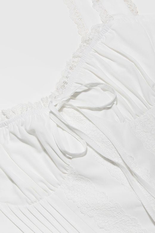 Woman wearing a figure flattering Belle Bodycon Mini Dress - Pearl White BODYCON COLLECTION