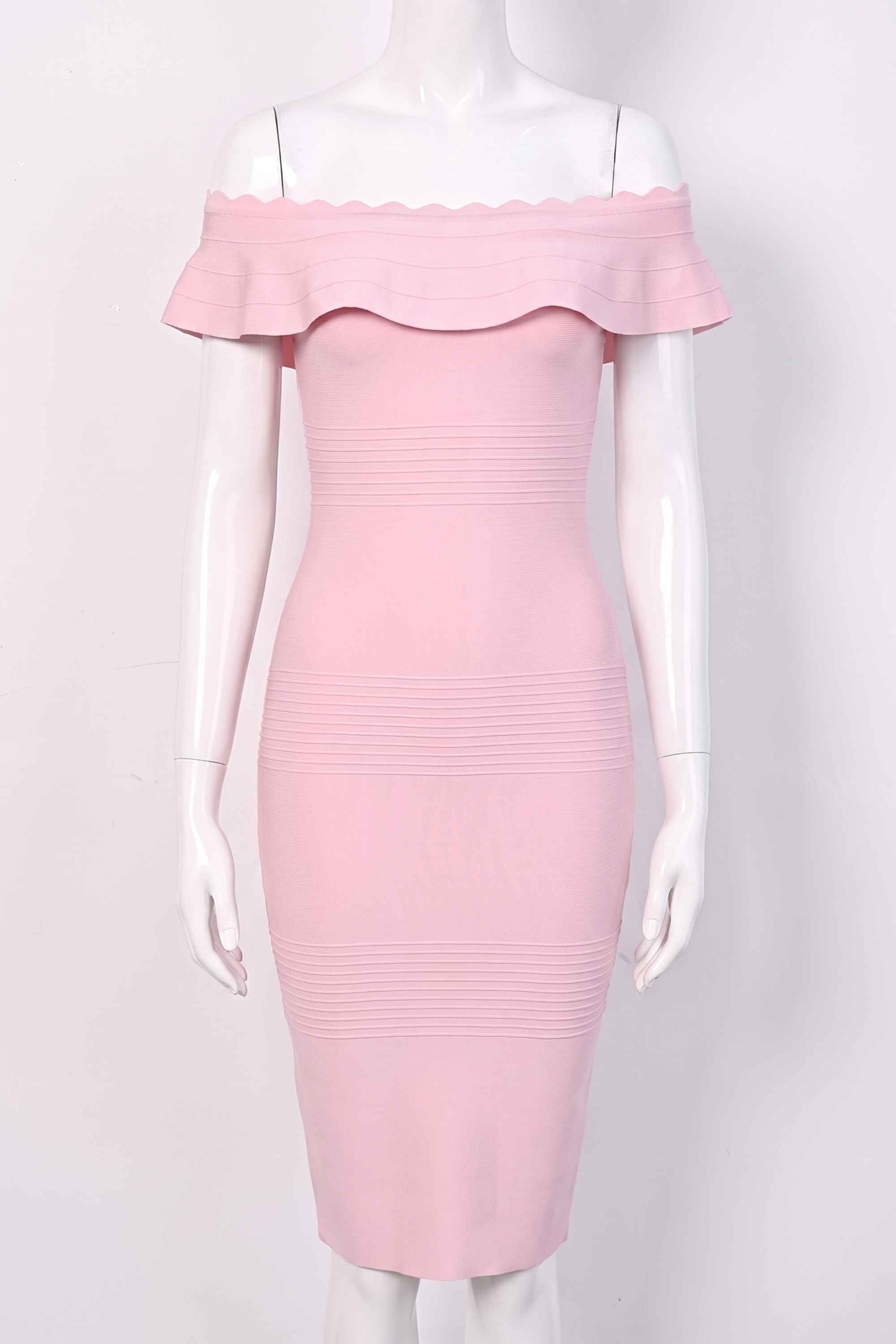 Woman wearing a figure flattering Billie Bandage Midi Dress - Dusty Pink Bodycon Collection