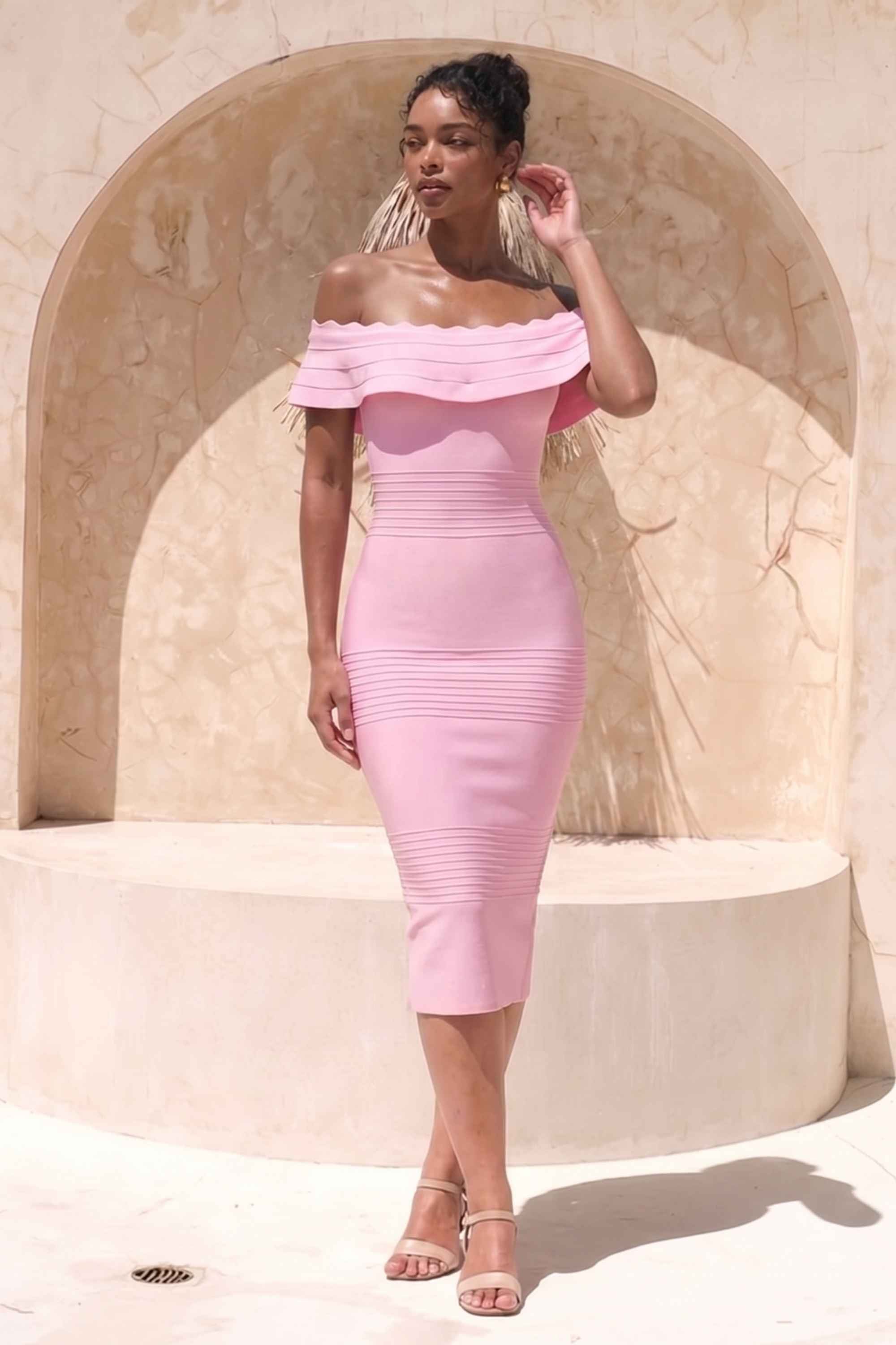 Woman wearing a figure flattering Billie Bandage Midi Dress - Dusty Pink Bodycon Collection
