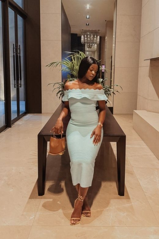 Woman wearing a figure flattering Billie Bandage Midi Dress - Mint Green Bodycon Collection