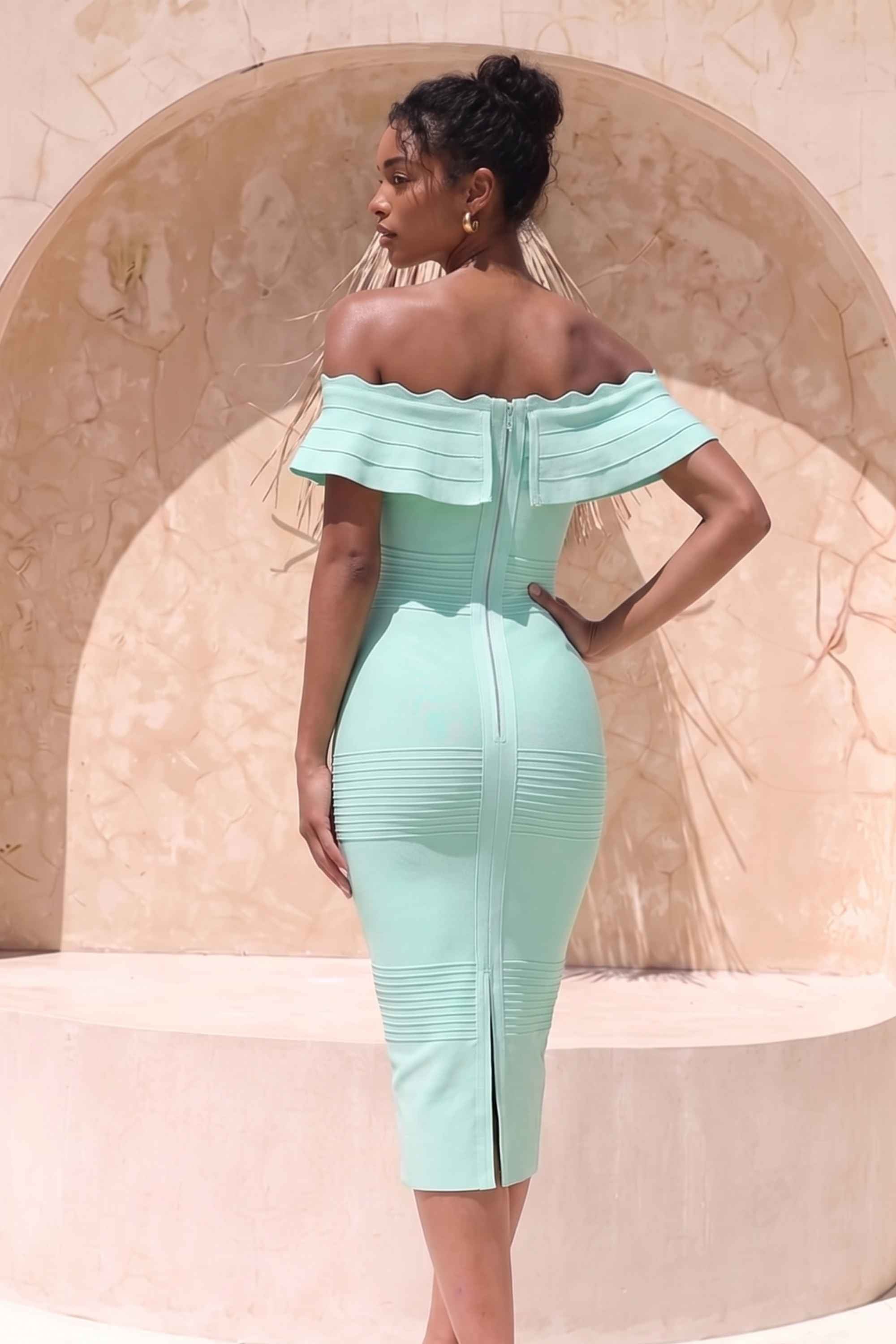 Woman wearing a figure flattering Billie Bandage Midi Dress - Mint Green Bodycon Collection