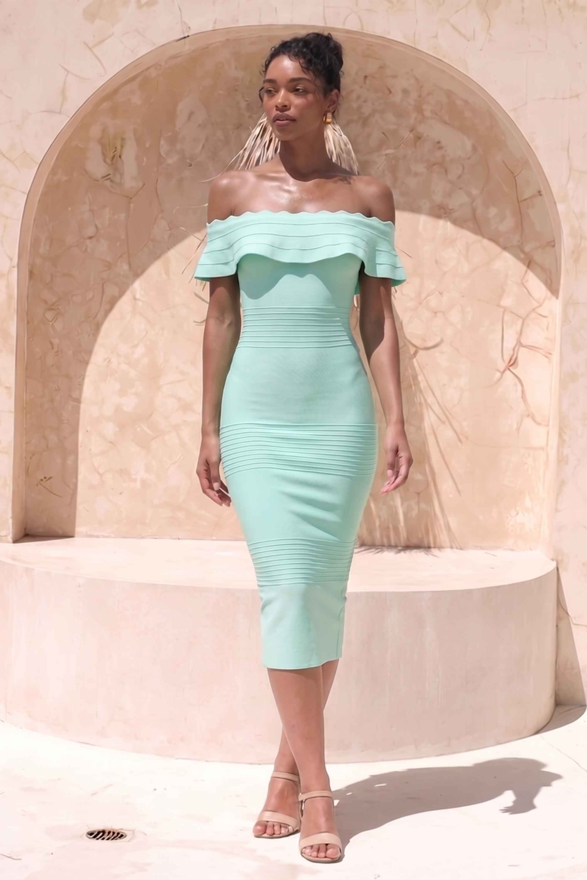 Woman wearing a figure flattering Billie Bandage Midi Dress - Mint Green Bodycon Collection