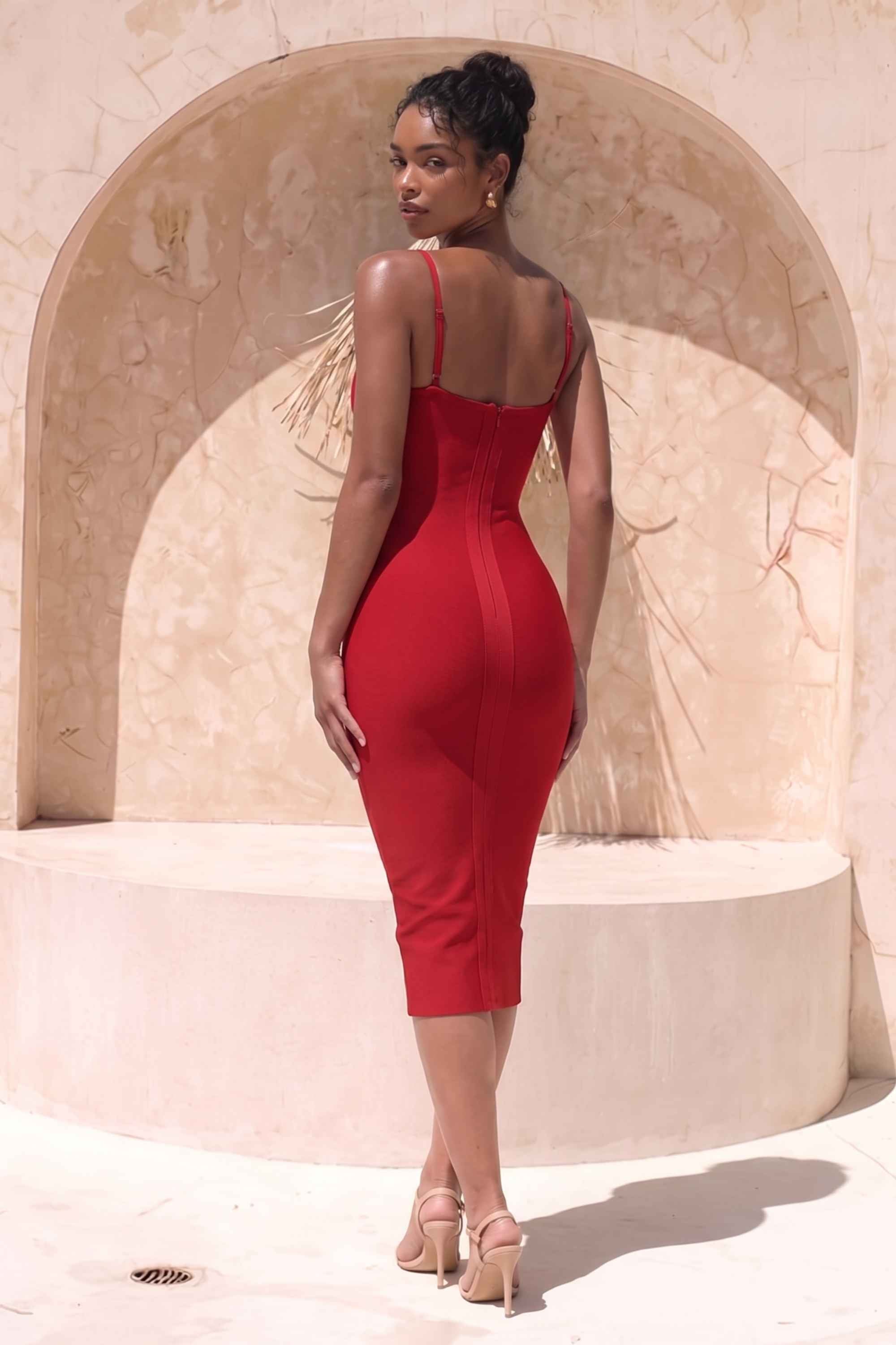 Woman wearing a figure flattering Blanche Bandage Midi Dress - Lipstick Red BODYCON COLLECTION