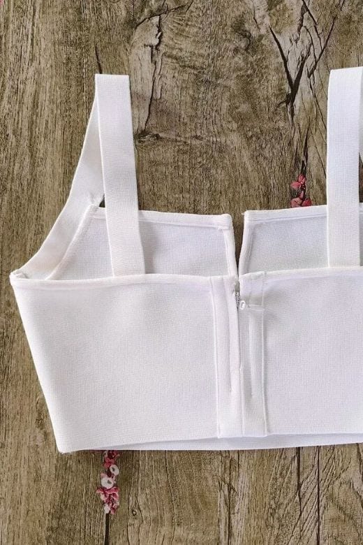 Woman wearing a figure flattering Brooke Bandage Crop Top - Pearl White BODYCON COLLECTION