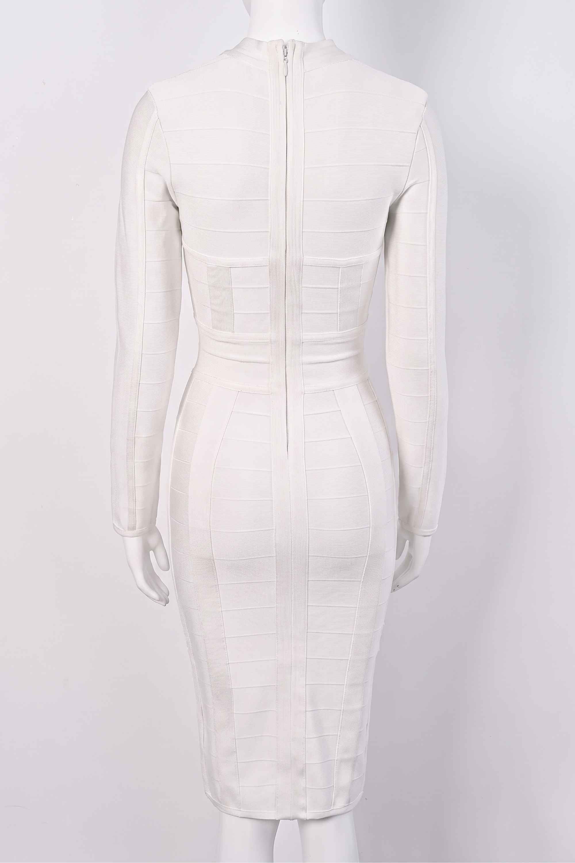 Woman wearing a figure flattering Brooke Long Sleeve Bandage Dress - Pearl White BODYCON COLLECTION