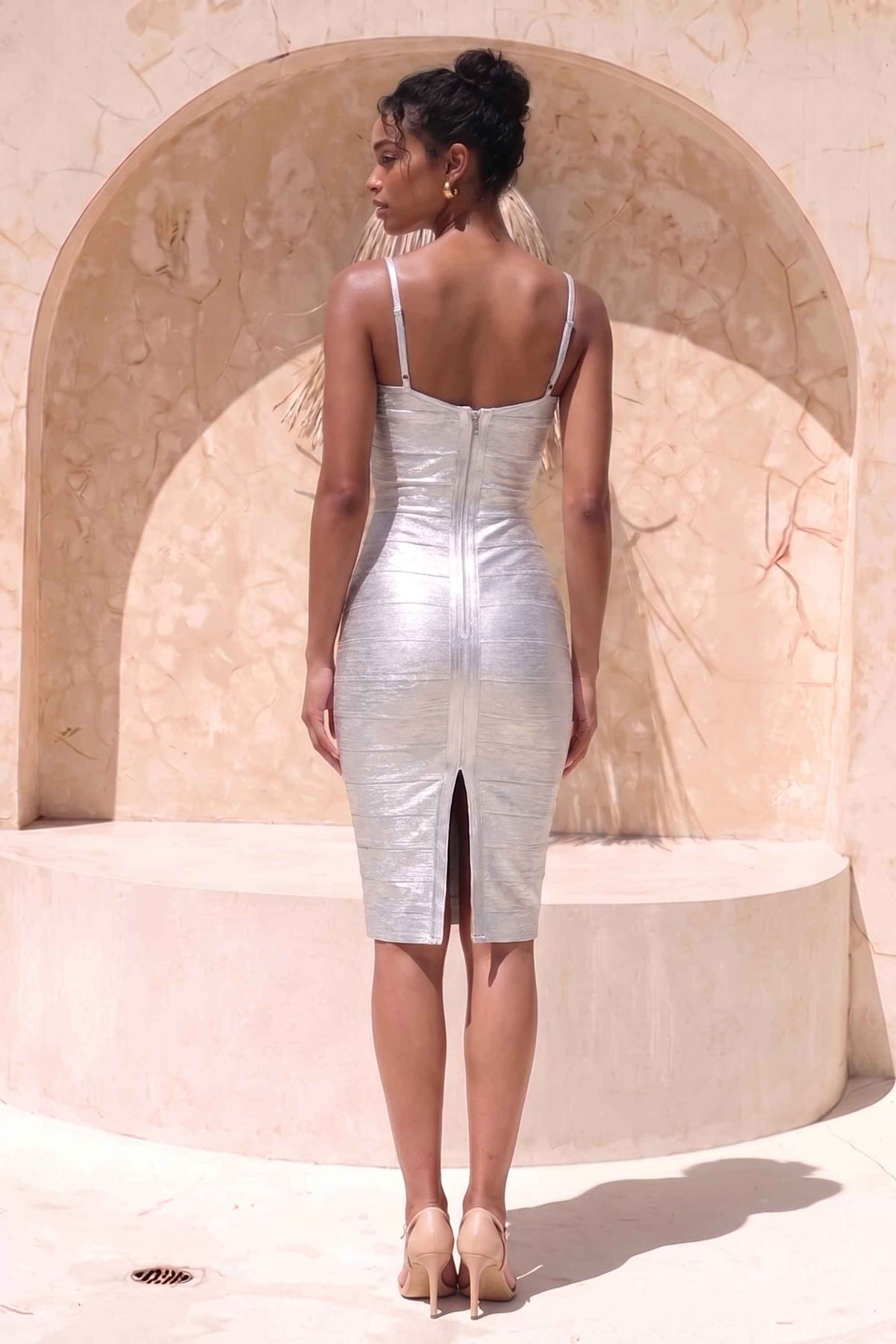 Woman wearing a figure flattering Camila Bandage Dress - Silver BODYCON COLLECTION Pty Ltd