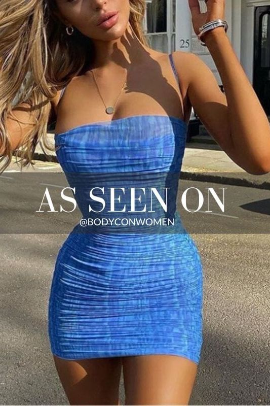 Woman wearing a figure flattering Cassie Bodycon Wrap Mini Dress - Royal Blue BODYCON COLLECTION