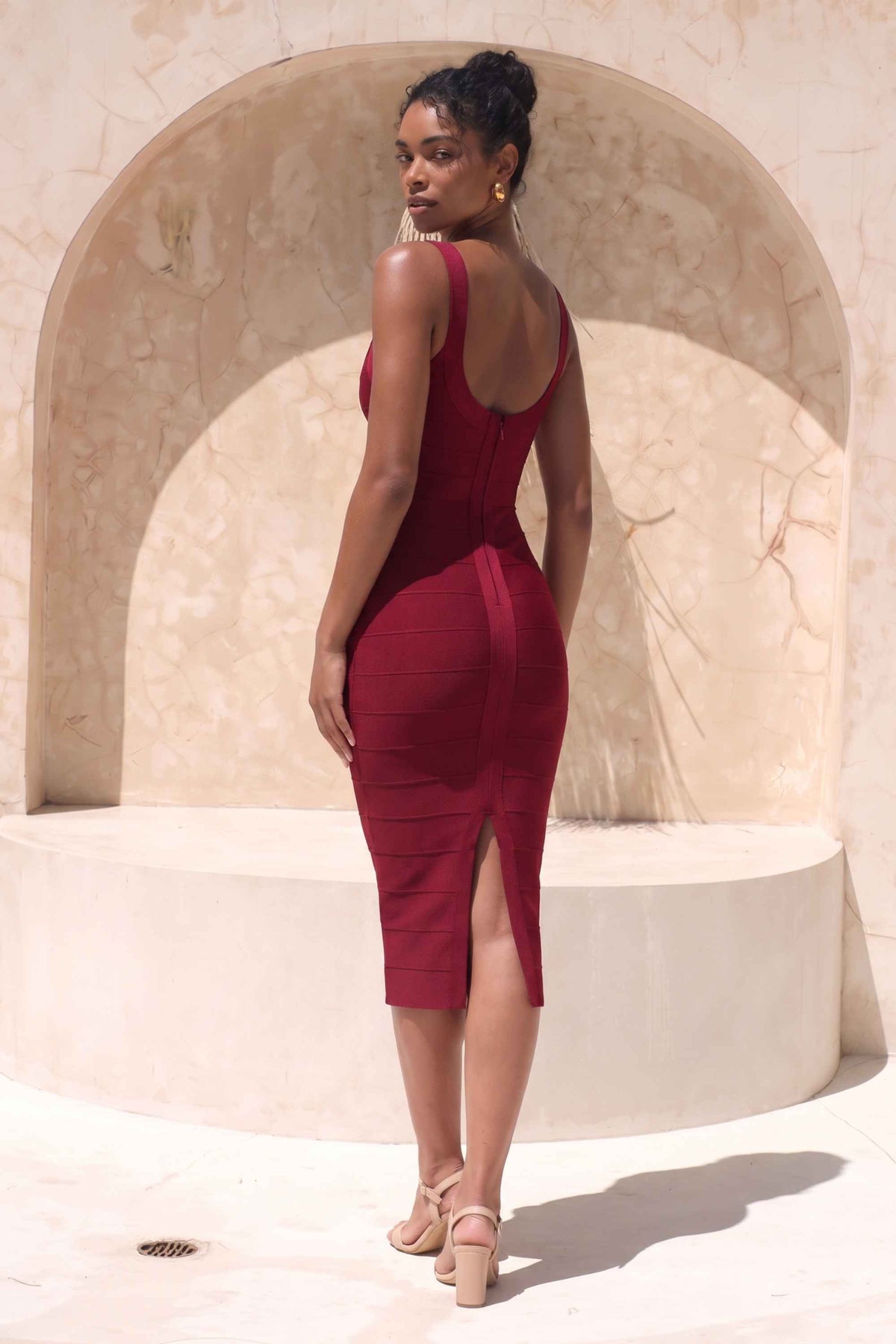 Woman wearing a figure flattering Cindy Bandage Midi Dress - Red Wine BODYCON COLLECTION Pty Ltd