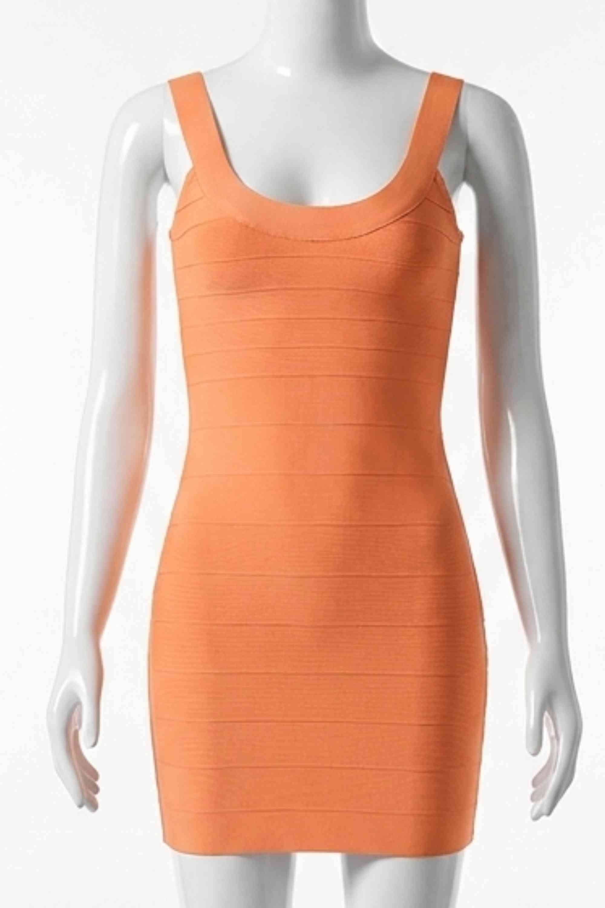 Woman wearing a figure flattering Cindy Bandage Mini Dress - Apricot Orange BODYCON COLLECTION Pty Ltd