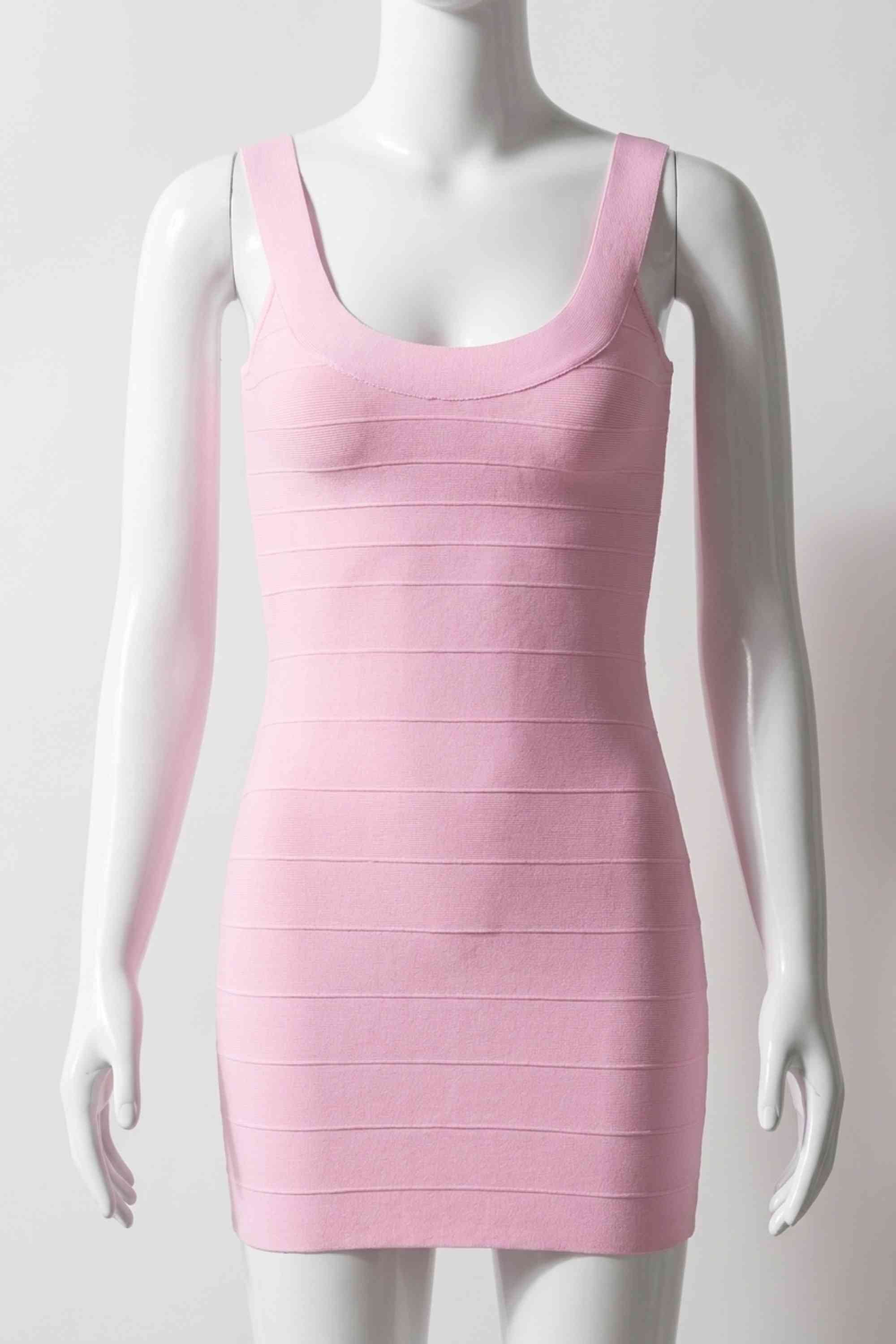 Woman wearing a figure flattering Cindy Bandage Mini Dress - Dusty Pink BODYCON COLLECTION Pty Ltd