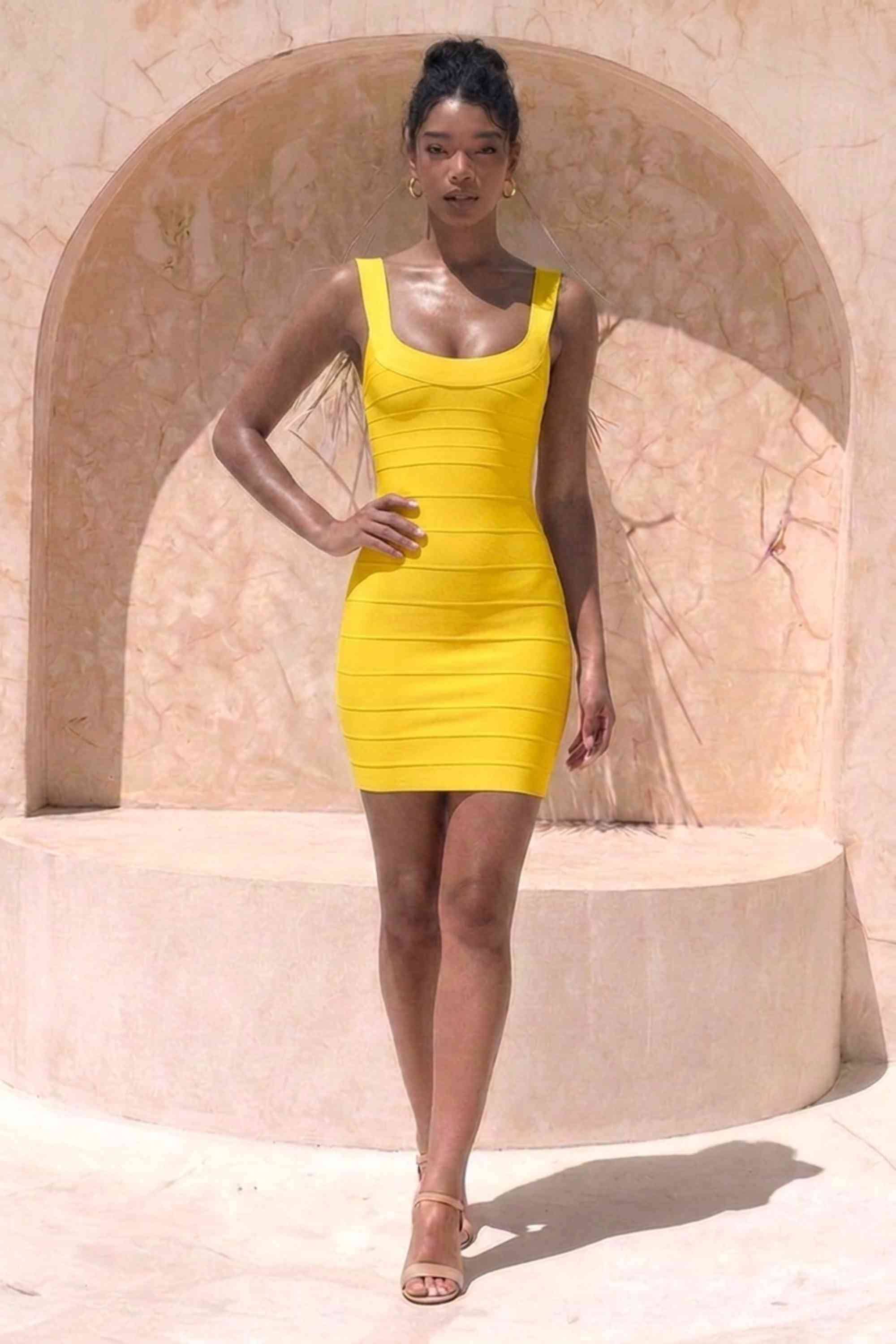 Woman wearing a figure flattering Cindy Bandage Mini Dress - Mustard Yellow BODYCON COLLECTION Pty Ltd