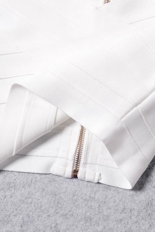 Woman wearing a figure flattering Cindy Bandage Off Shoulder Crop Top - Pearl White BODYCON COLLECTION