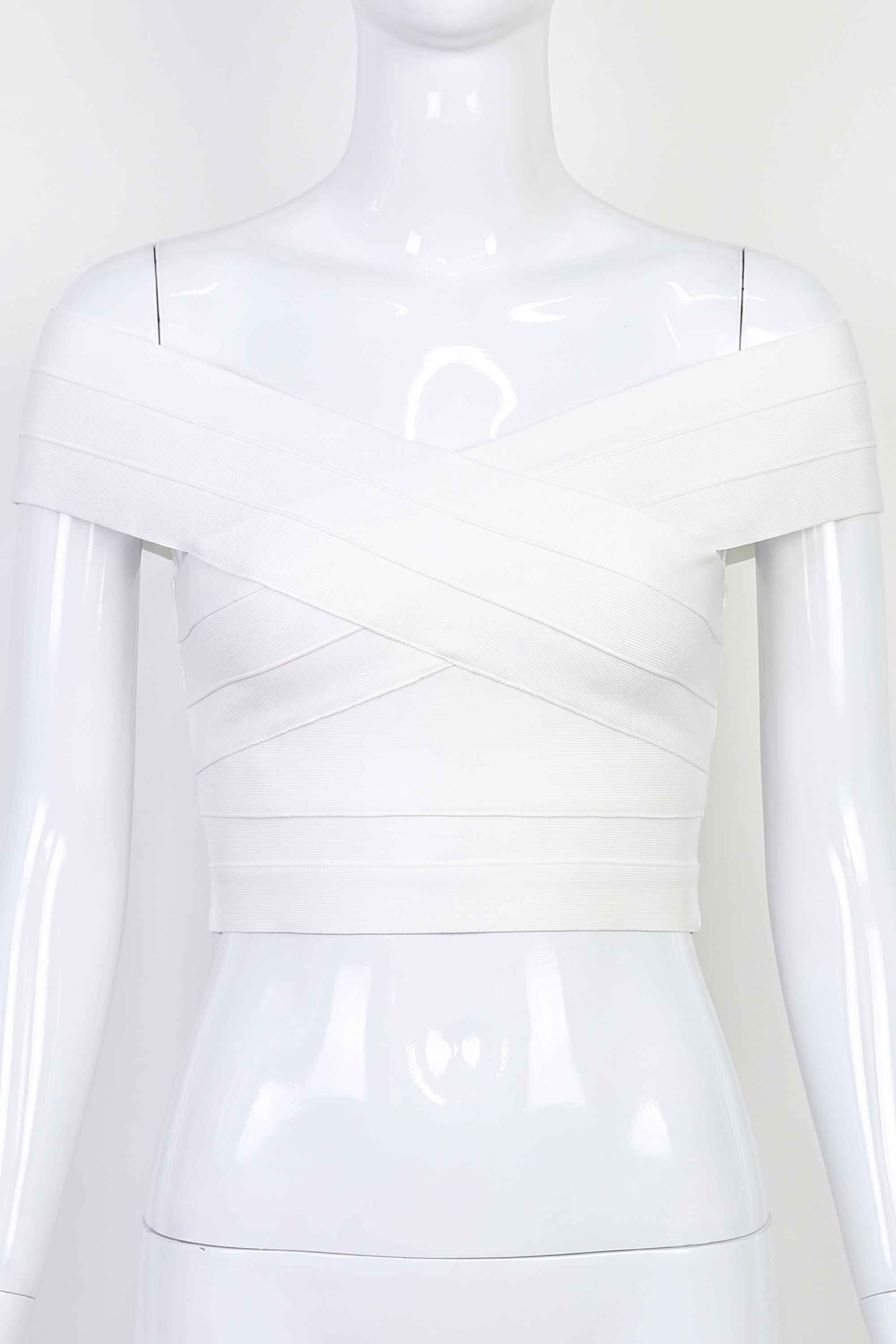 Woman wearing a figure flattering Cindy Bandage Off Shoulder Crop Top - Pearl White BODYCON COLLECTION