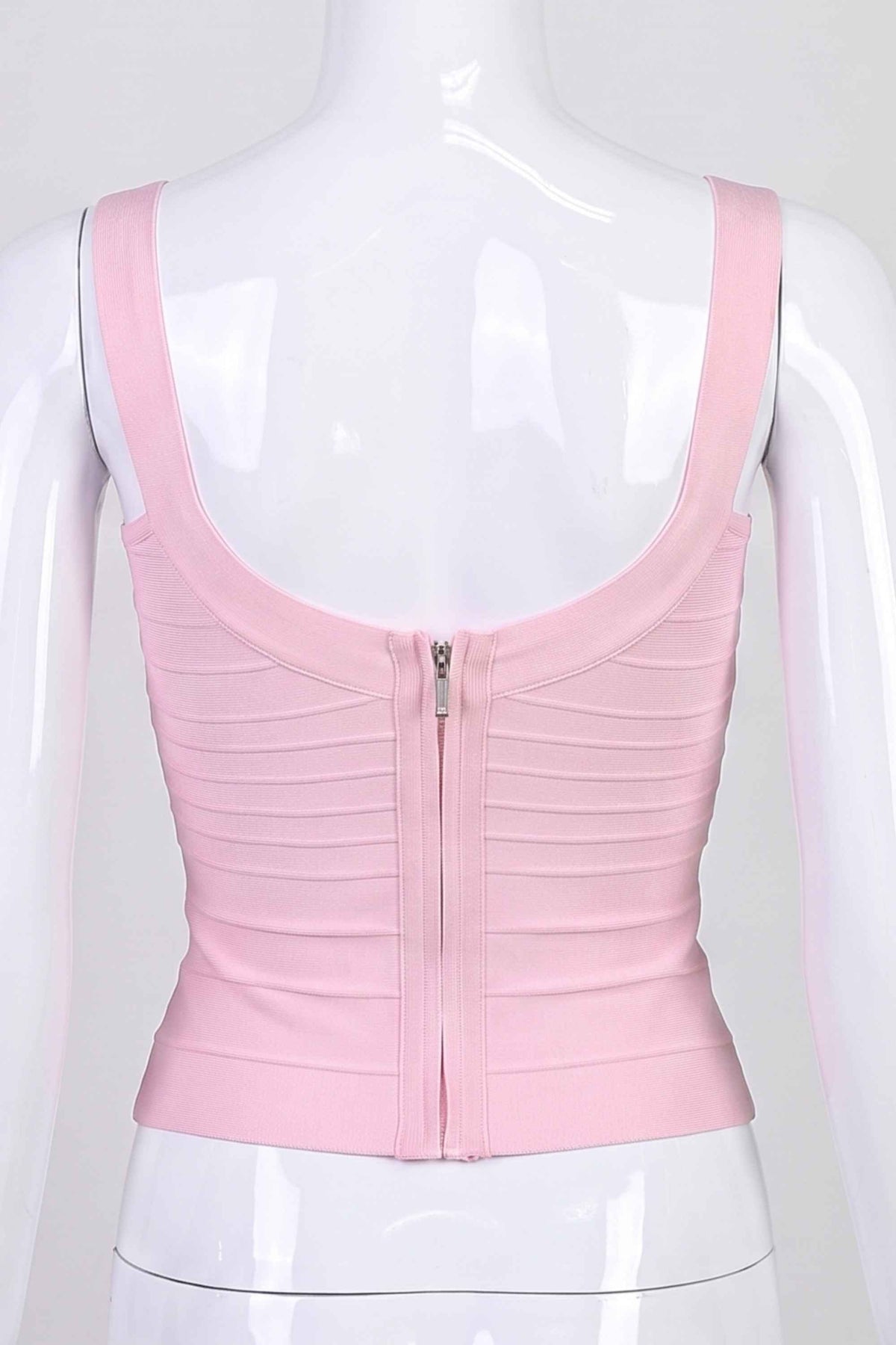 Woman wearing a figure flattering Cindy Bandage Top - Dusty Pink BODYCON COLLECTION Pty Ltd
