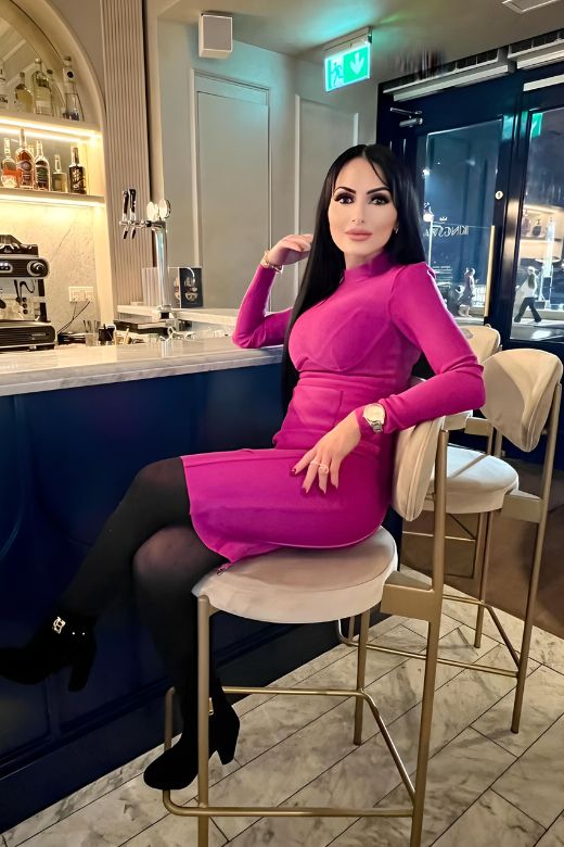 Woman wearing a figure flattering Dee Long Sleeve Bandage Dress - Classic Black BODYCON COLLECTION