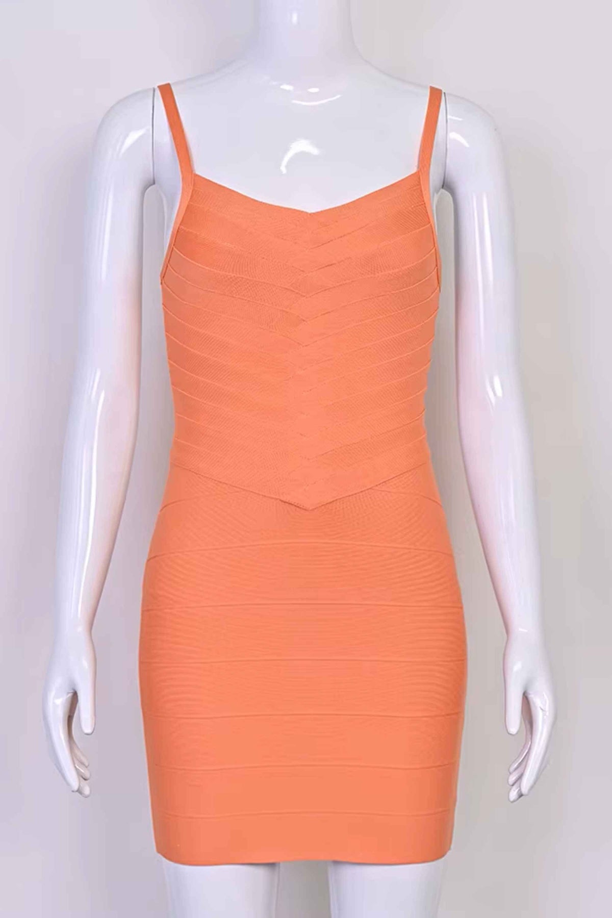 Woman wearing a figure flattering Dom Bandage Mini Dress - Coral BODYCON COLLECTION Pty Ltd