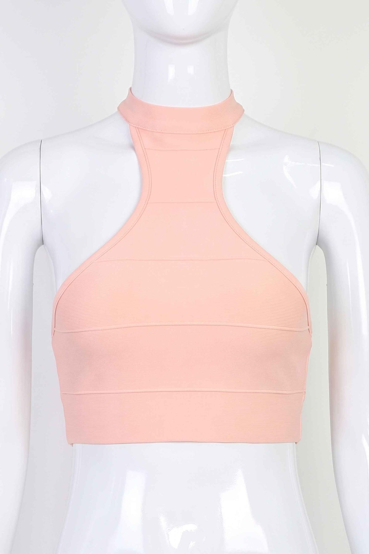 Woman wearing a figure flattering Elli Bandage Crop Top - Dusty Pink BODYCON COLLECTION