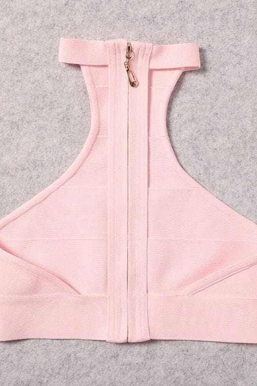 Woman wearing a figure flattering Elli Bandage Crop Top - Dusty Pink BODYCON COLLECTION