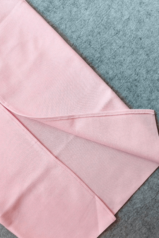 Woman wearing a figure flattering Erin Bodycon Maxi Dress - Dusty Pink BODYCON COLLECTION