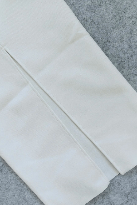 Woman wearing a figure flattering Erin Bodycon Maxi Dress - Pearl White BODYCON COLLECTION