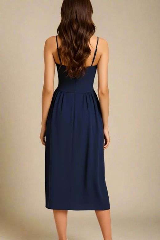 Woman wearing a figure flattering Everly Midi Dress - Navy Blue BODYCON COLLECTION
