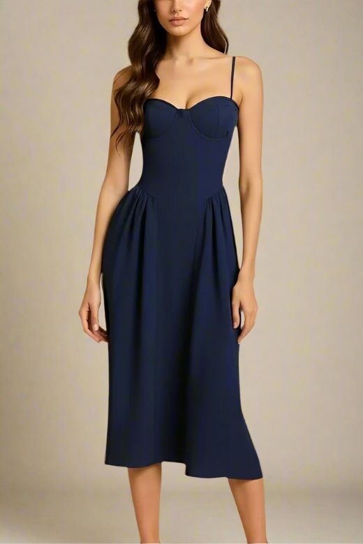 Woman wearing a figure flattering Everly Midi Dress - Navy Blue BODYCON COLLECTION