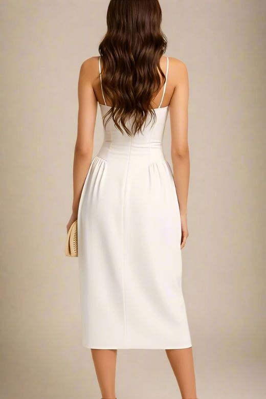 Woman wearing a figure flattering Everly Midi Dress - White Pearl BODYCON COLLECTION