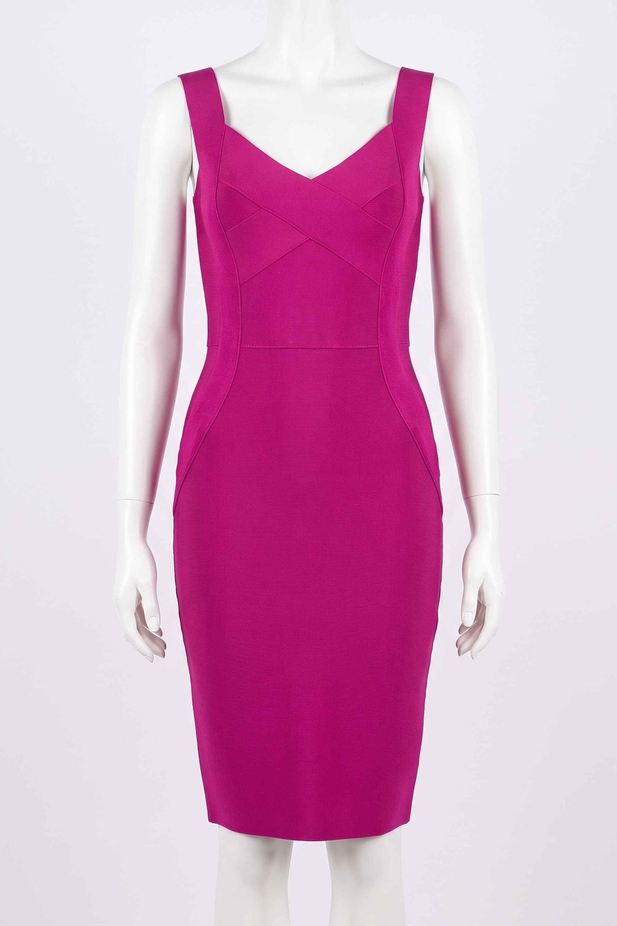 Woman wearing a figure flattering Freya Bandage Dress - Magenta Pink BODYCON COLLECTION