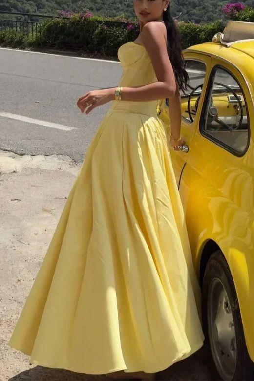 Woman wearing a figure flattering Gabbi Bodycon Midi Dress - Sun Yellow BODYCON COLLECTION