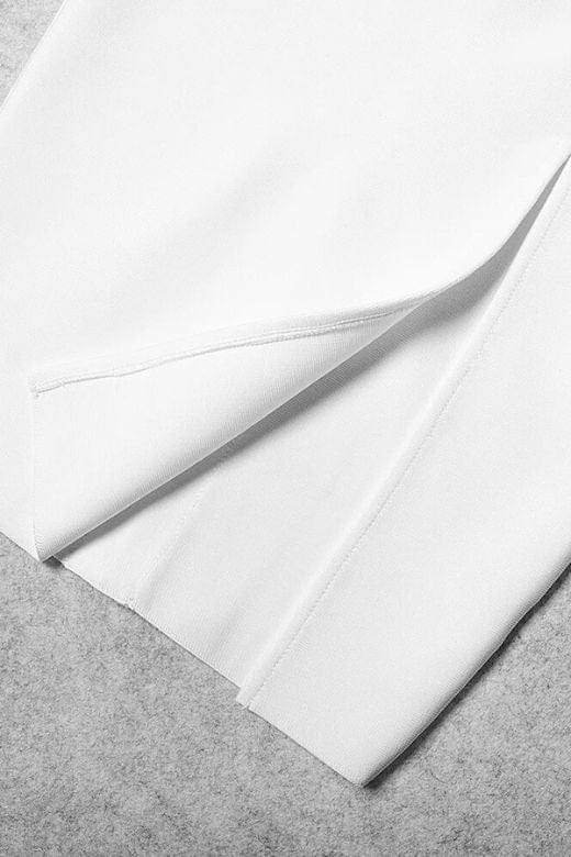 Woman wearing a figure flattering Gianna Bandage Dress - Nude BODYCON COLLECTION