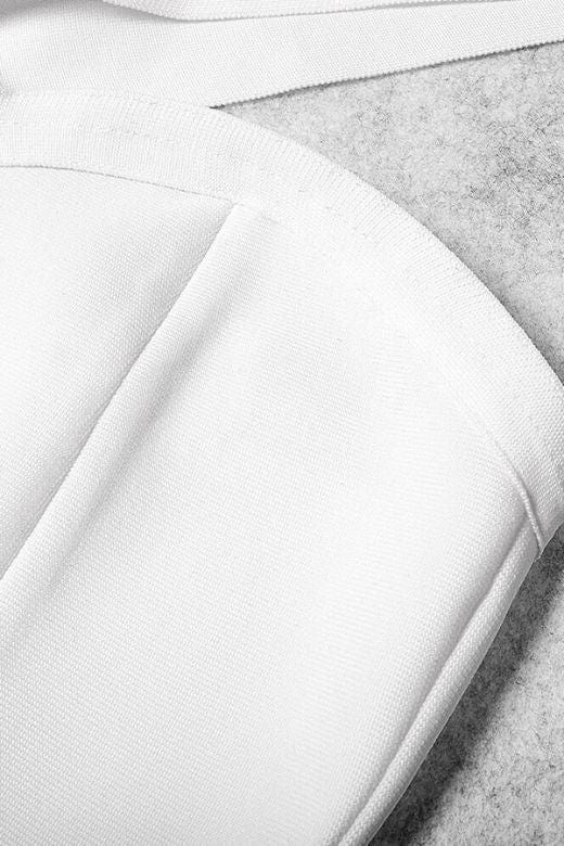 Woman wearing a figure flattering Gianna Bandage Dress - Nude BODYCON COLLECTION