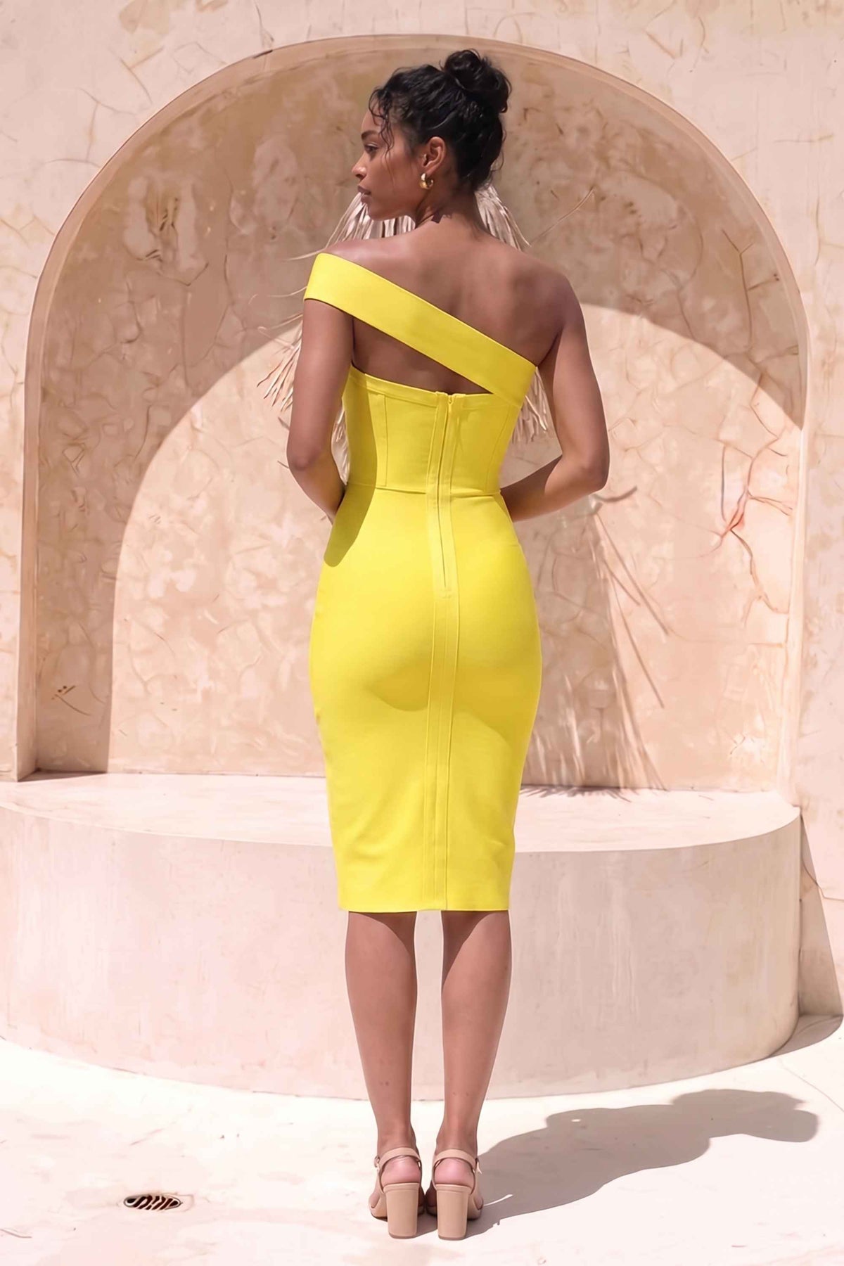 Woman wearing a figure flattering Gianna Bandage Dress - Sun Yellow BODYCON COLLECTION